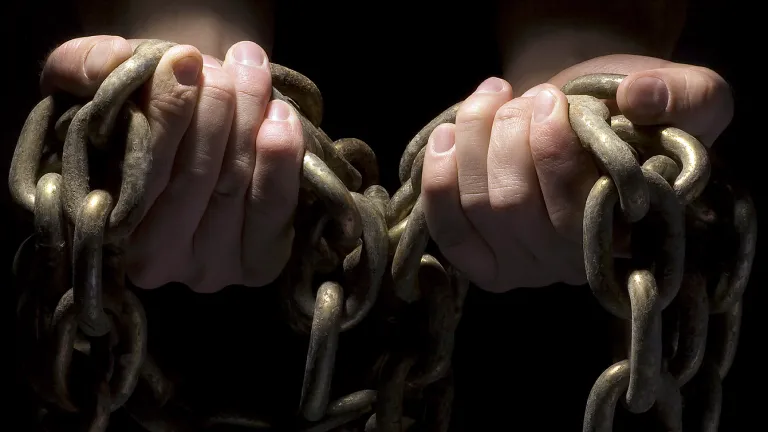 The apostle Paul compared the effects of sin to slavery—the opposite of liberty. Hands holding chains.